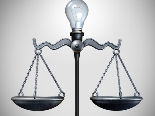 Scales of Justice with lightbulb of invention