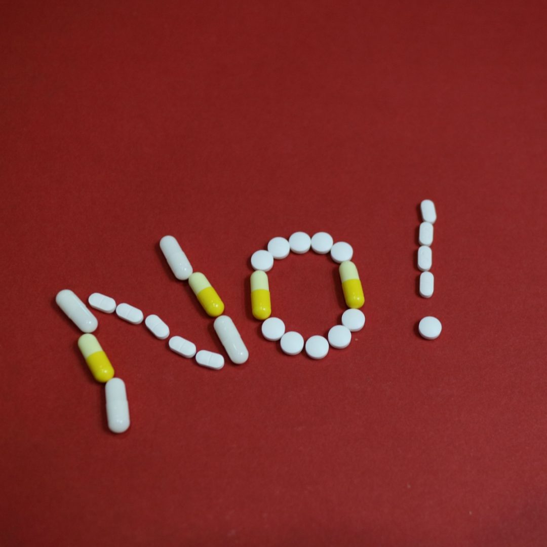 The word 'no' spelled out in pills