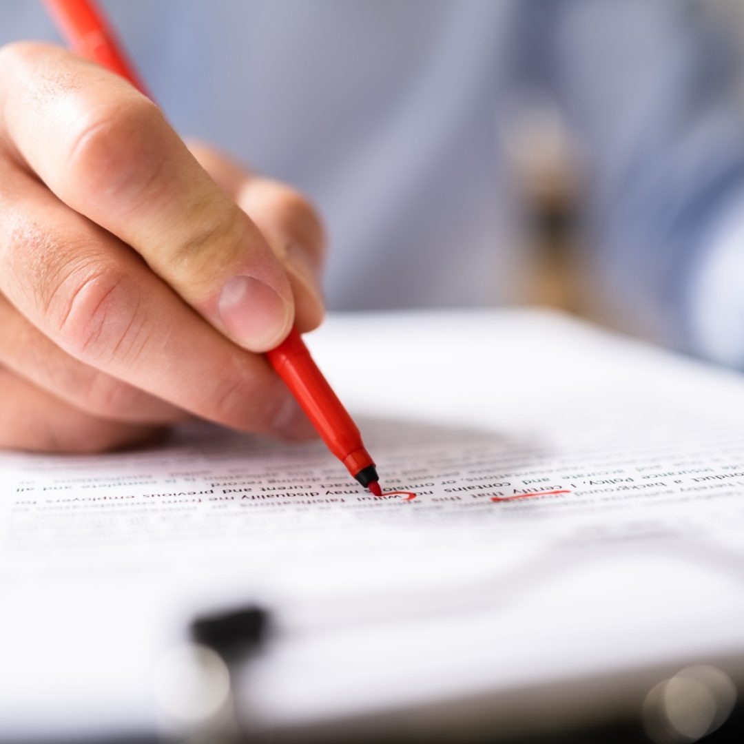 editing a document with red pen